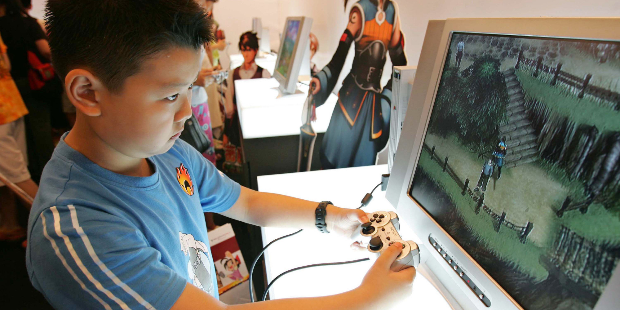 SHANGHAI, CHINA - JUNE 30: (CHINA OUT)  A young boy plays Sony's Playstation 2 video game system at the 2005 Shanghai Animation FairJune 30, 2005 in Shanghai, China. China has a population of 370 million children and young people, making up a huge audience for cartoons and animation. Currently, 90 percent of the market is dominated by foreign producers from Japan and the U.S., with the largest share going to Japan. Most domestic cartoons are criticized for being old-fashioned and lackluster due to little originality in story and characters, dryness of content and persistent educational flavor.  (Photo by China Photos/Getty Images)
